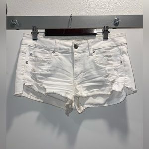 White ripped jean shorts